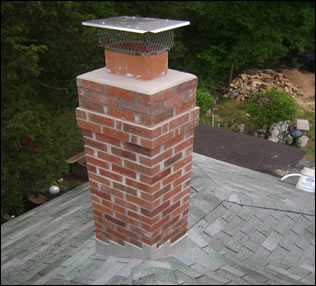Newly rebuilt chimney with new crown and chimney cap
