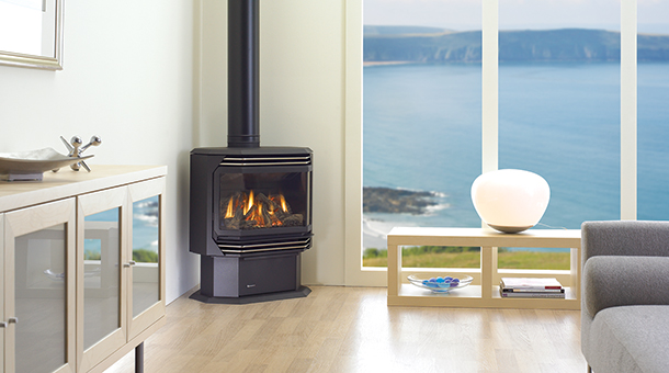 Regency Ultimate U39 Medium Gas Stove in corner of living room with ocean view in background