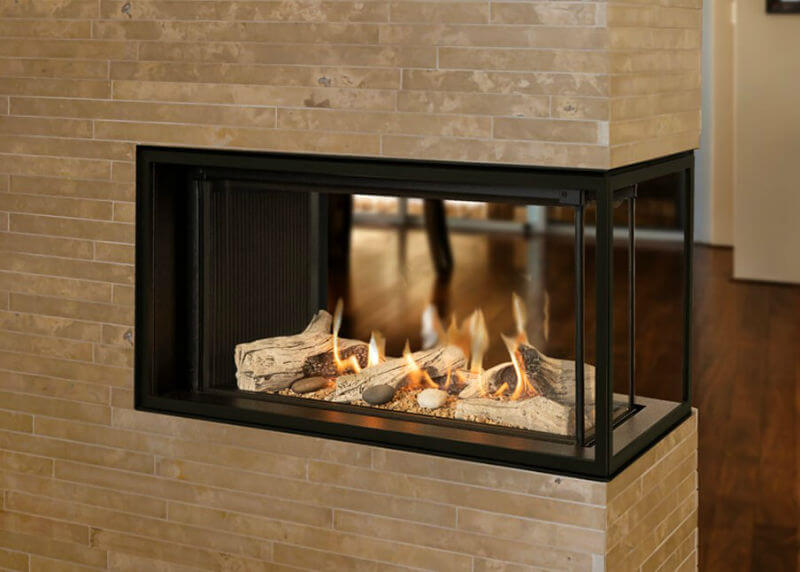 Valor Multi-Sided Lx1 Gas Fireplace - a smaller 3 sided corner fireplace set in a stone wall