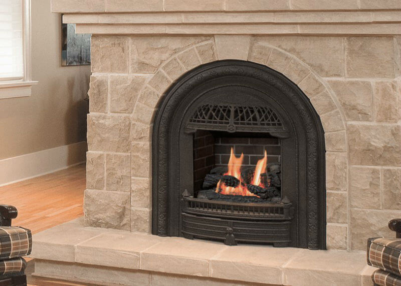 Valor Portrait Gas Insert  with Windsor arch front with natural stone surround, mantle, and hearth