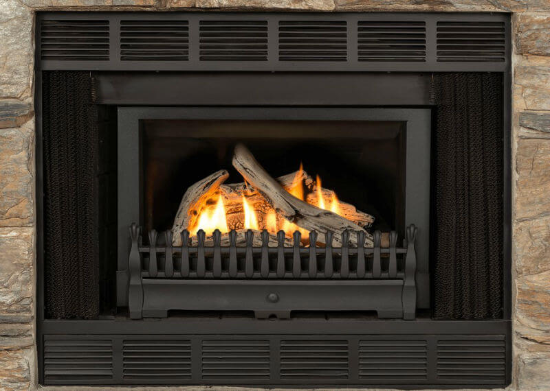 Valor RetroFire Gas Insert set in existing wood fireplace with stone surround