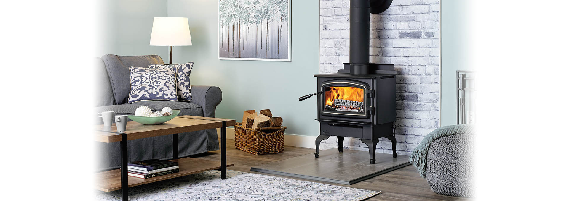 Regency F1150 Wood Stove lit in front of white brick heat shield in living room