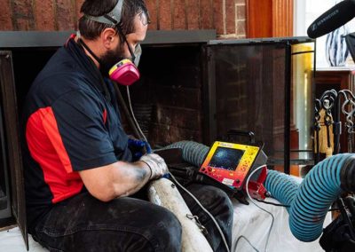 Technician Performing Digital Chimney Inspection
