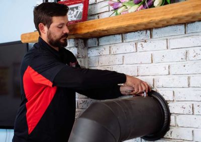 Technician clamping hose for chimney vacuum
