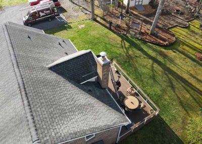 Aerial view of completed chimney restoration with new crown and cap