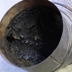 black creosote in a round flue bend