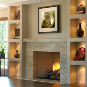a lit fireplace in a furnished living room