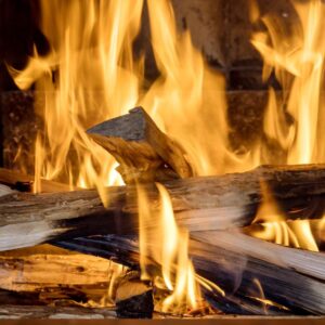 close up view of blazing flames fueled by wood logs